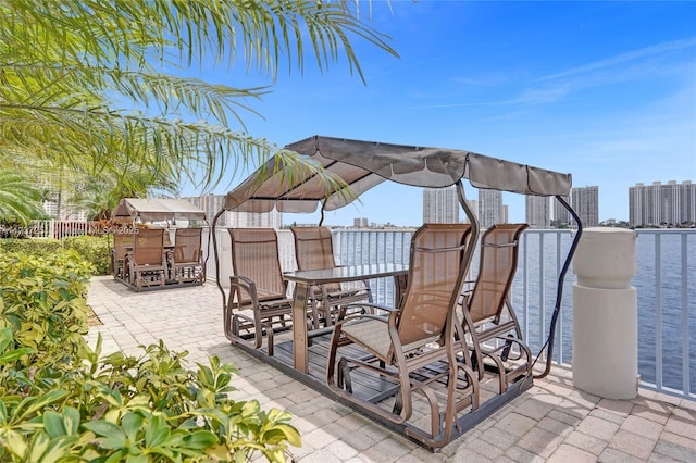 view of patio with a water view