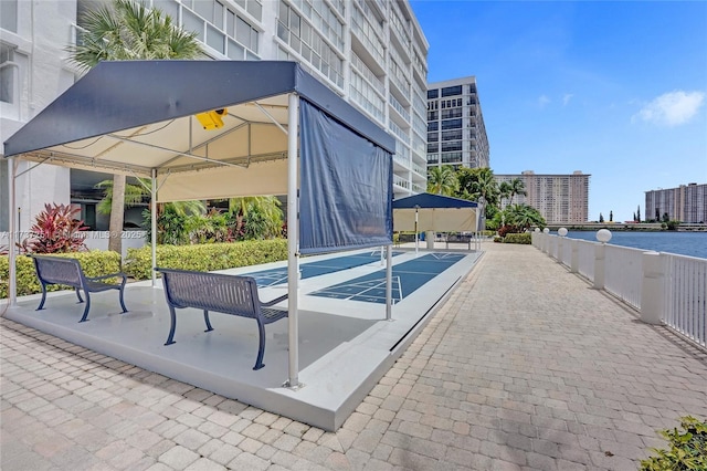 view of swimming pool featuring a water view