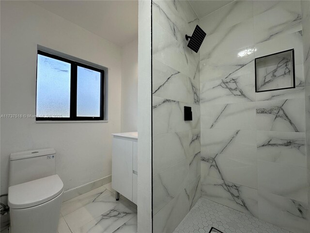 860 NW 171st St, Miami Gardens, FL 33169 - bathroom featuring vanity, toilet, and a tile shower