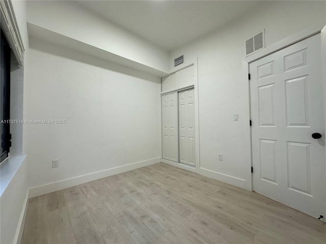 860 NW 171st St, Miami Gardens, FL 33169 - unfurnished bedroom featuring light hardwood / wood-style floors and a closet