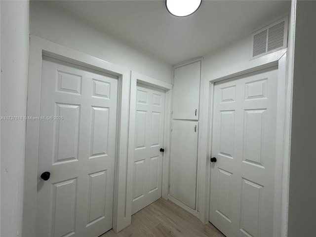 860 NW 171st St, Miami Gardens, FL 33169 - hallway featuring light hardwood / wood-style floors