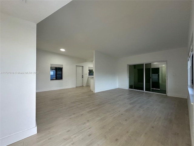 860 NW 171st St, Miami Gardens, FL 33169 - unfurnished living room with light hardwood / wood-style flooring