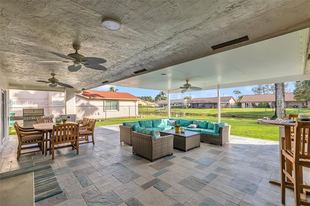 view of patio / terrace featuring ceiling fan, area for grilling, grilling area, and outdoor lounge area