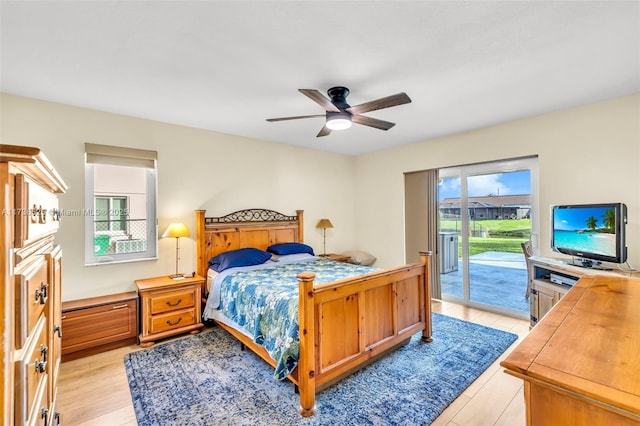 bedroom with ceiling fan and access to exterior