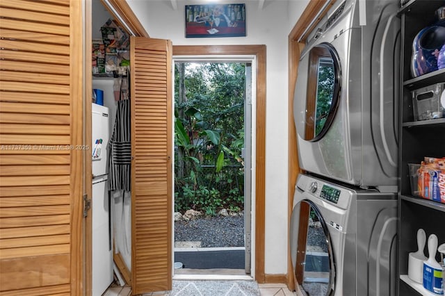 laundry area with stacked washer and clothes dryer