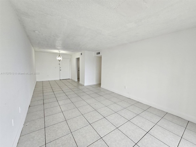 empty room featuring a textured ceiling