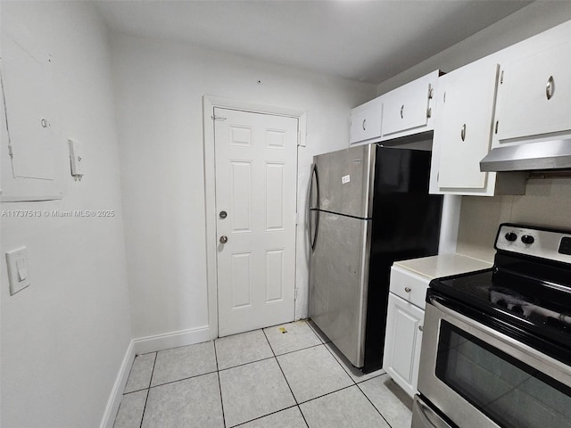 kitchen featuring white cabinetry, light tile patterned floors, and stainless steel appliances