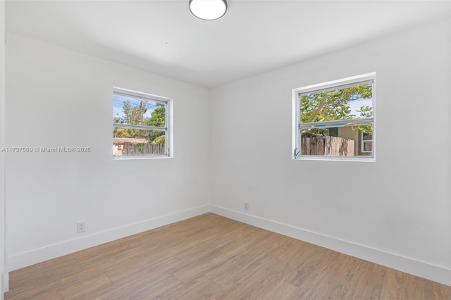 empty room with light hardwood / wood-style floors