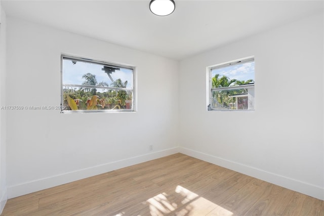 spare room featuring light hardwood / wood-style floors