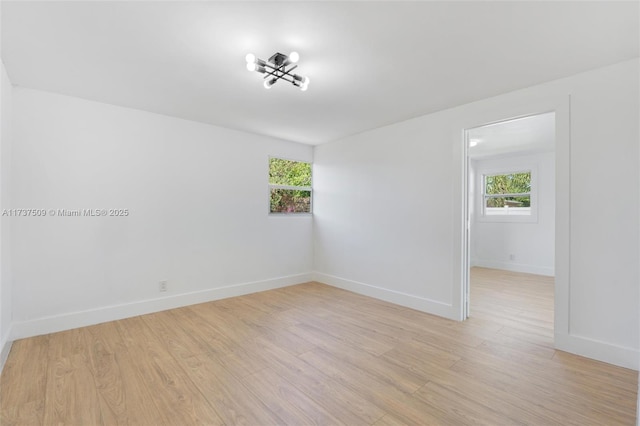 spare room with light hardwood / wood-style floors