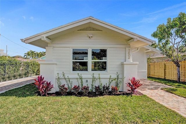 bungalow with a front yard