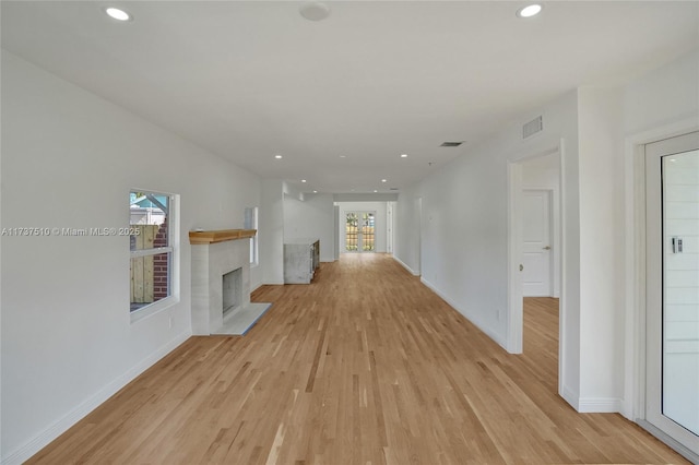 unfurnished living room featuring light hardwood / wood-style floors