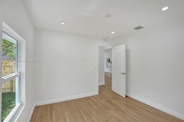 empty room with light wood-type flooring