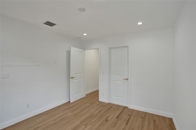 spare room with light hardwood / wood-style floors