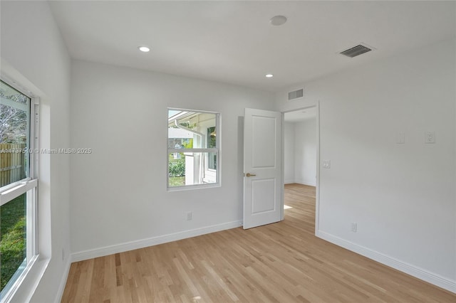 unfurnished room featuring light wood-type flooring