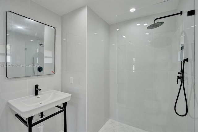 bathroom with tasteful backsplash, tile walls, and a tile shower