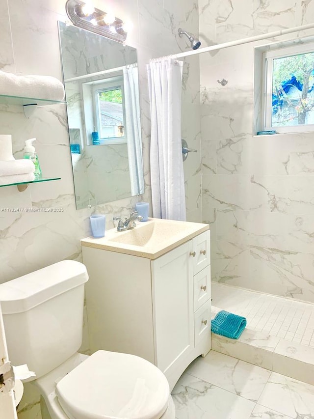 bathroom featuring vanity, curtained shower, and toilet