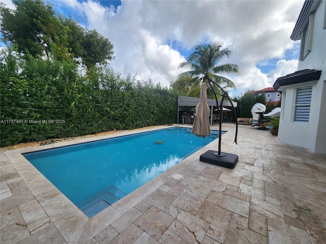 outdoor pool with a patio