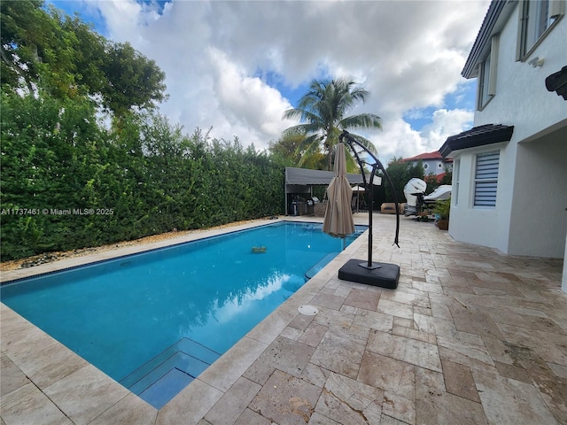 pool with a patio