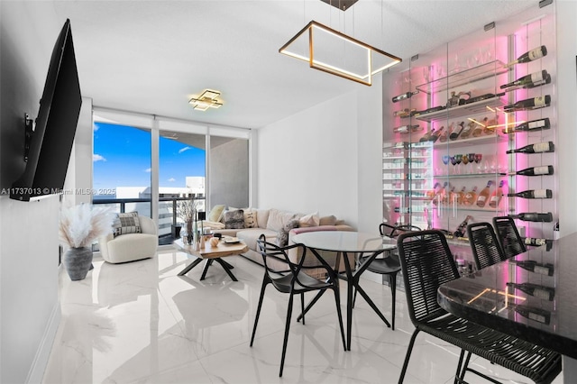 dining space featuring expansive windows