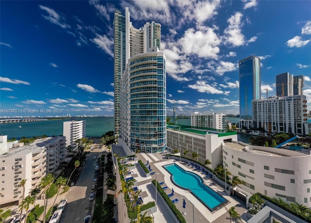 birds eye view of property with a water view