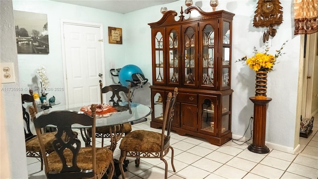 dining space with light tile patterned floors