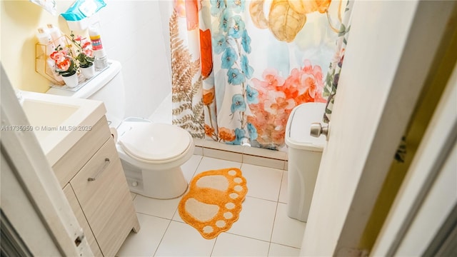 bathroom featuring tile patterned floors, toilet, curtained shower, and vanity