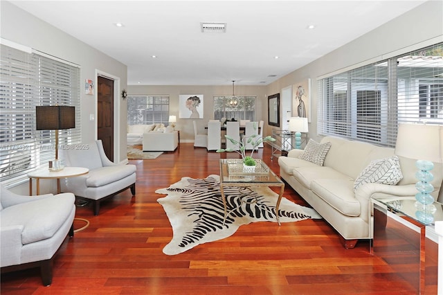 living room with dark hardwood / wood-style flooring