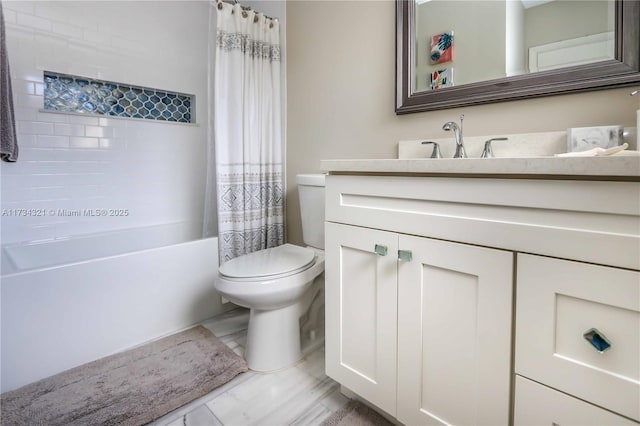 full bathroom with shower / bath combination with curtain, vanity, and toilet