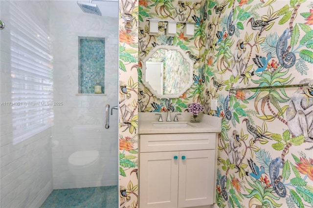 bathroom with an enclosed shower and vanity