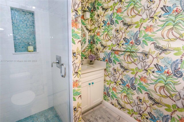 bathroom with vanity and a shower with shower door