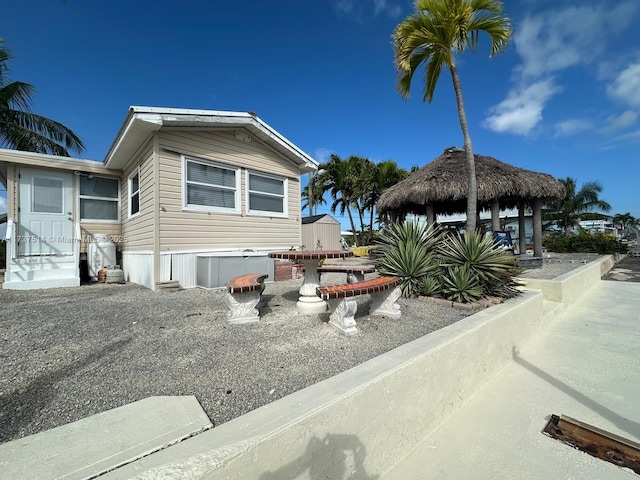 view of property exterior featuring a gazebo