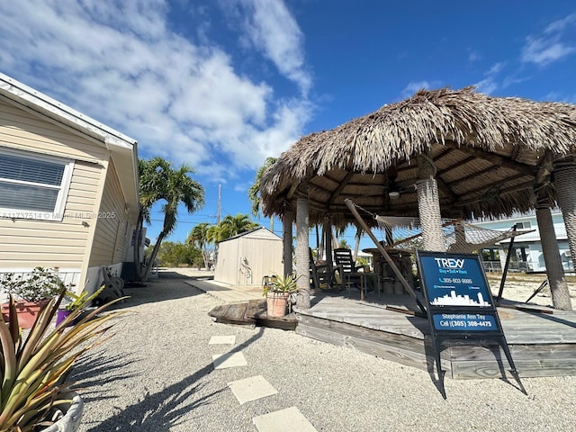 exterior space with a gazebo, a shed, and an outdoor structure