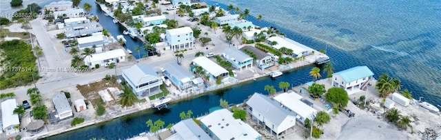 aerial view with a residential view and a water view