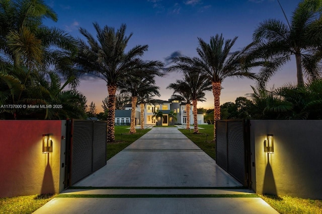 view of gate at dusk