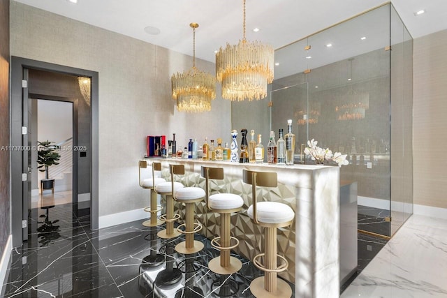 bar featuring a chandelier, decorative light fixtures, and light stone countertops