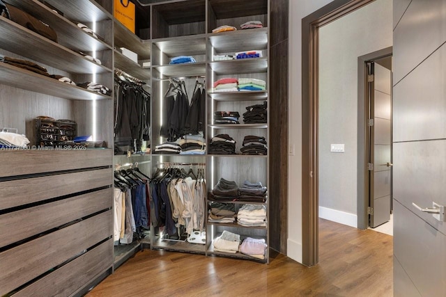 walk in closet featuring light wood-type flooring