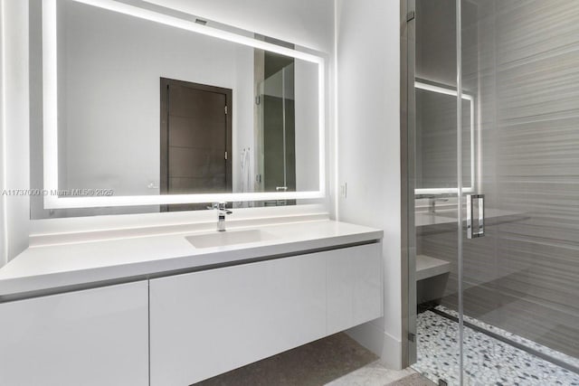 bathroom with vanity and an enclosed shower