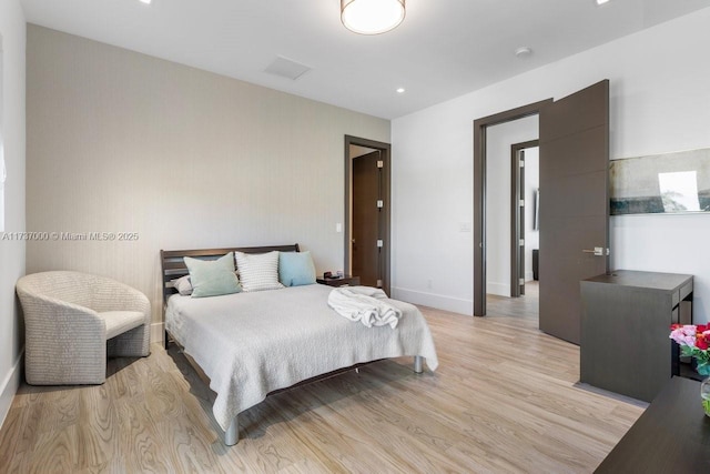 bedroom with light hardwood / wood-style floors