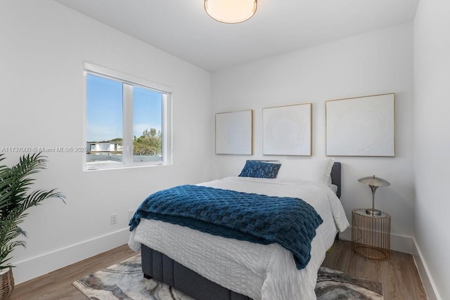 bedroom featuring hardwood / wood-style flooring