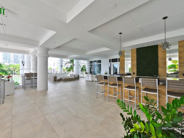 view of patio / terrace featuring an outdoor bar and ceiling fan