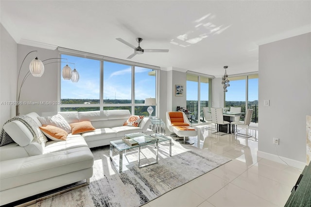 living room featuring a wealth of natural light, floor to ceiling windows, ceiling fan, and light tile patterned flooring