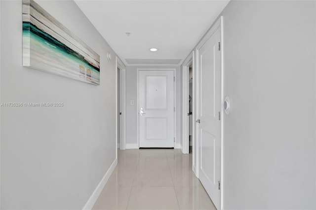 hallway featuring light tile patterned floors