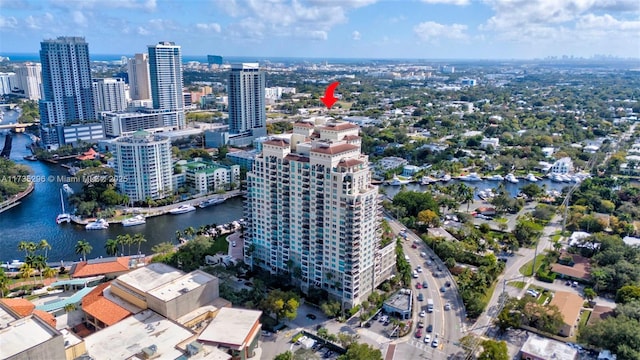 birds eye view of property with a water view