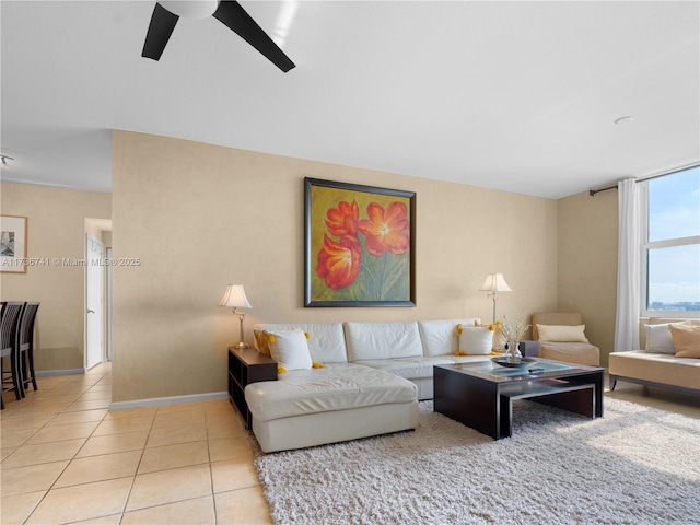 living room with light tile patterned flooring and ceiling fan