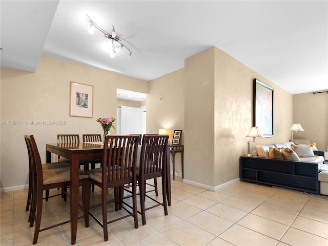 dining space featuring light tile patterned flooring