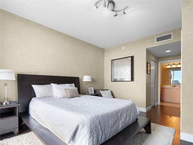 bedroom featuring wood-type flooring