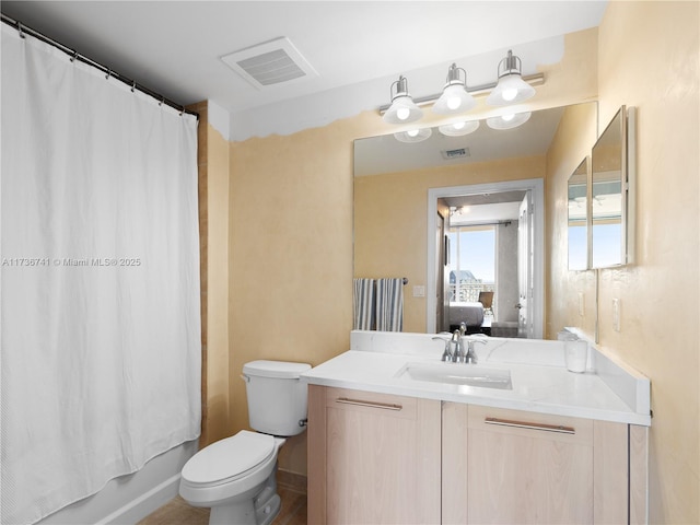 full bathroom featuring shower / bathtub combination with curtain, vanity, and toilet