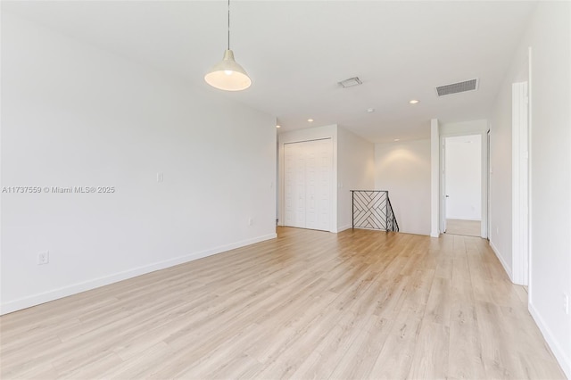 empty room featuring light hardwood / wood-style floors