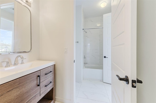 bathroom with vanity and shower / washtub combination